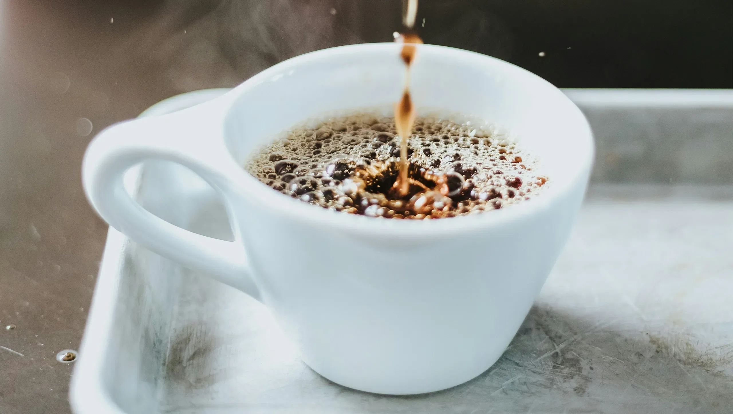 coffee pour into ceramic mug